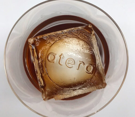 Cocktail at Atera served over a branded ice sphere