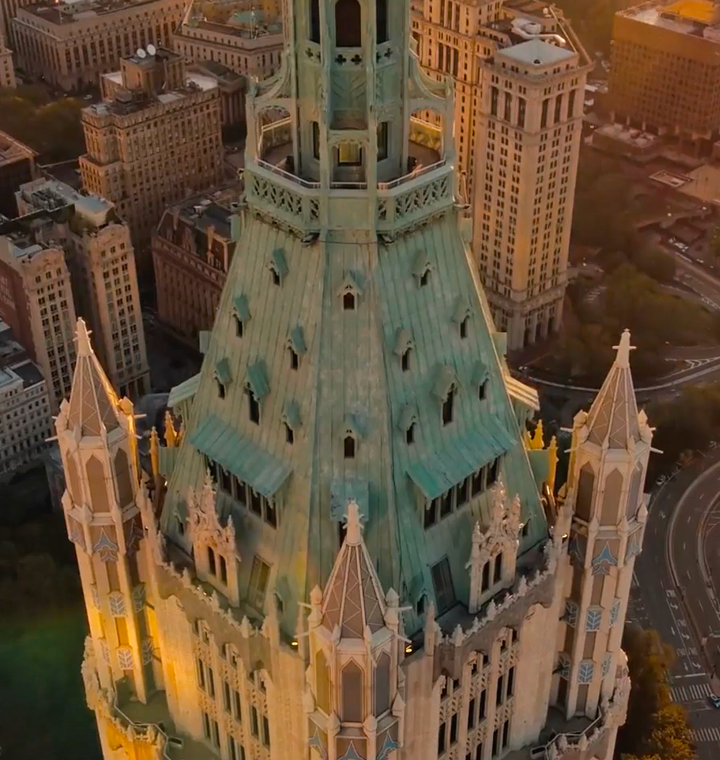Aerial view of the Woolworth Building's green copper roof and spire