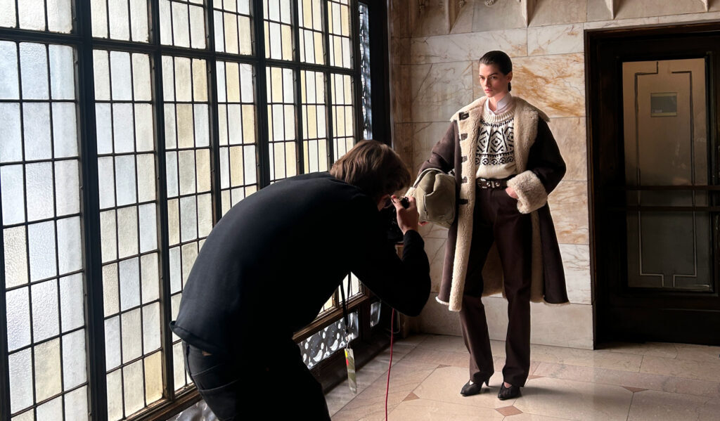 Photographer captures a model beside the Woolworth Building's Gothic windows