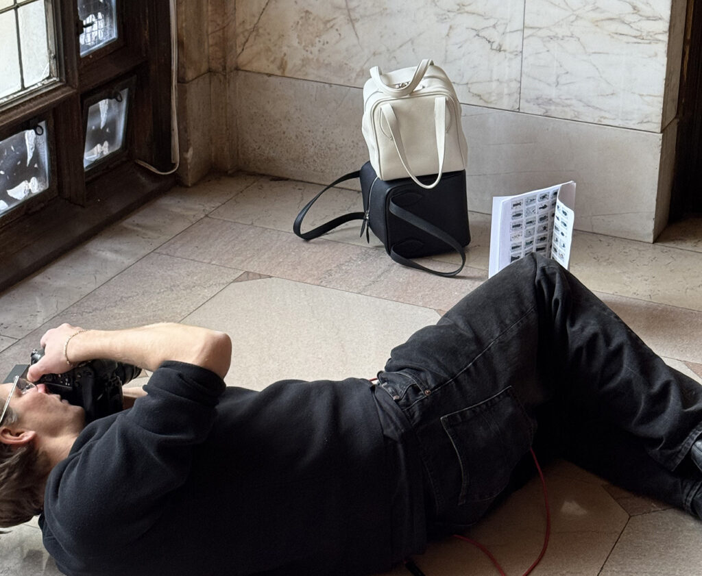 Photographer lies on the floor to photograph the Altuzarra show