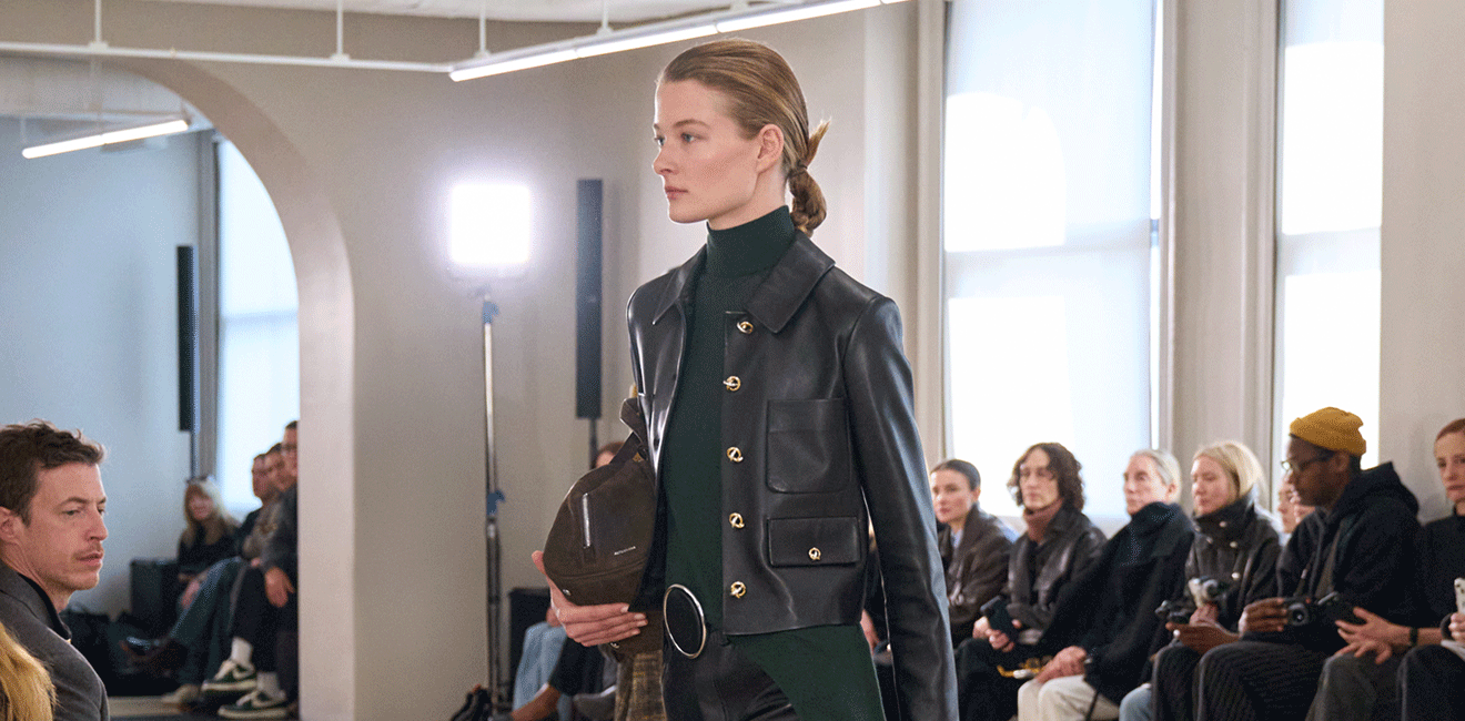 Model in a black leather look walks the Altuzarra runway