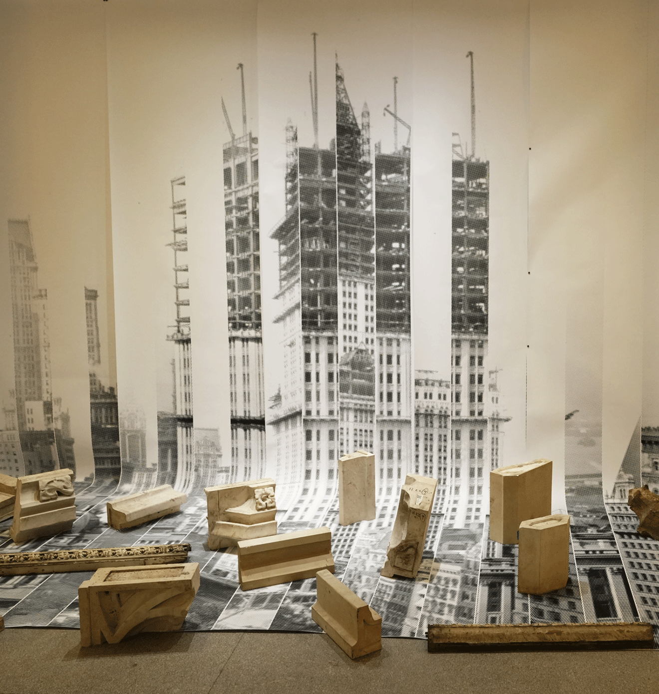 Visitor studies an architectural exhibition at The Woolworth