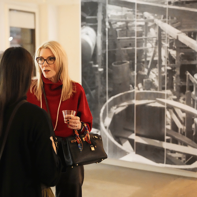 Guests view historic Woolworth Building photographs