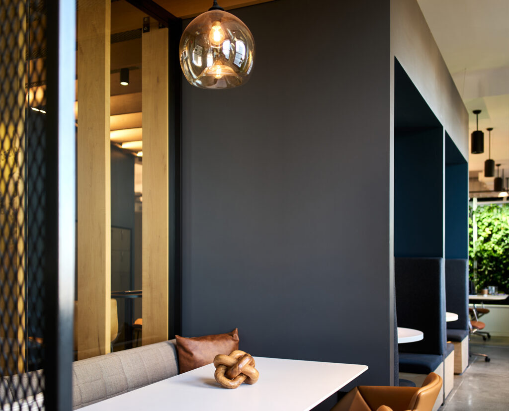 Custom-built office dining booth with integrated lighting