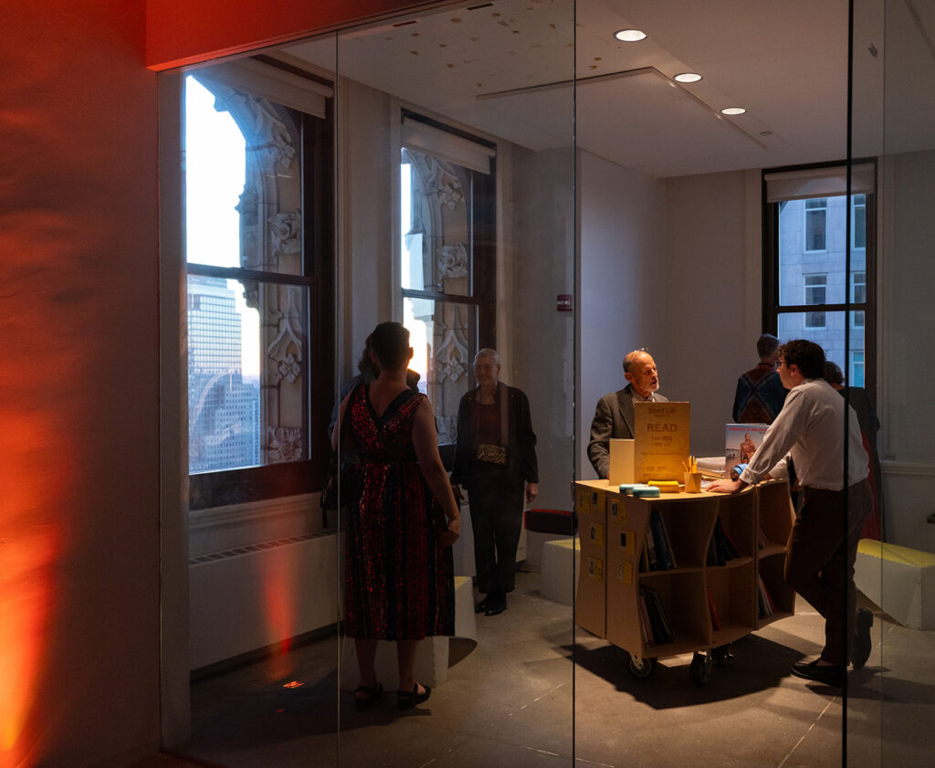 Guests gather around a catering table at The Woolworth