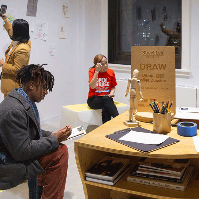 Attendees draw together at an event table