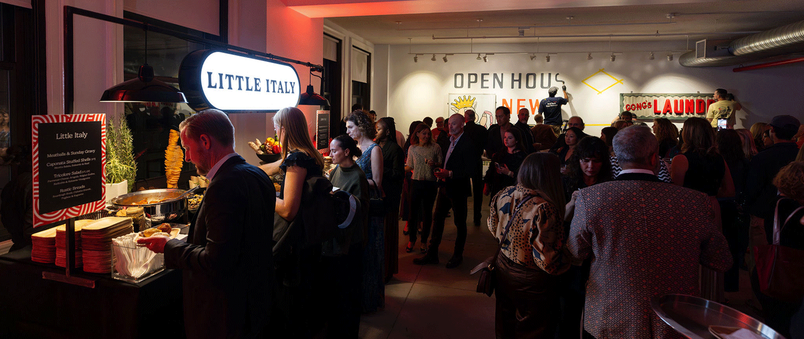 Open House New York guests gather around a food station