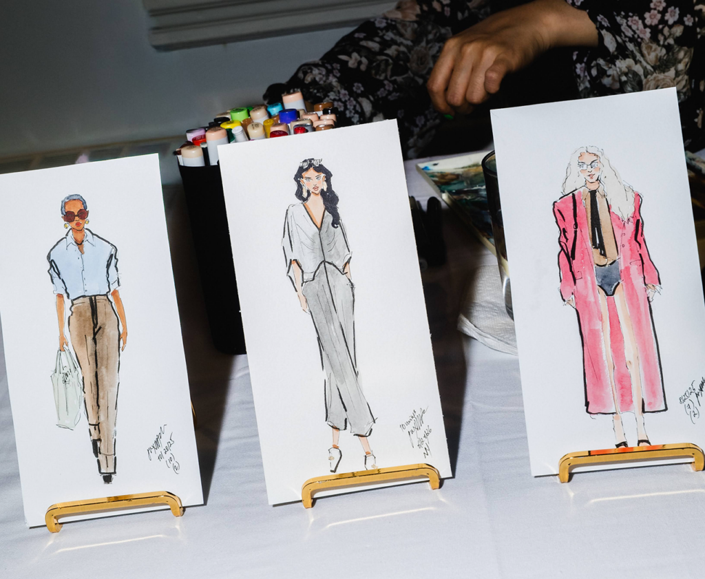 Fashion sketches displayed on miniature easels