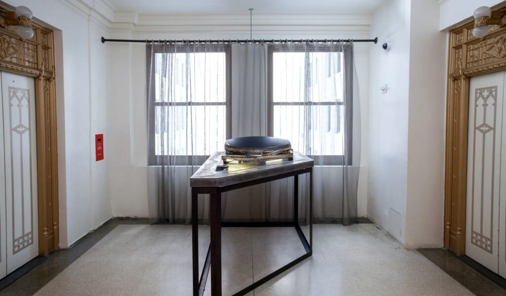 Architectural model displayed in a sunlit office