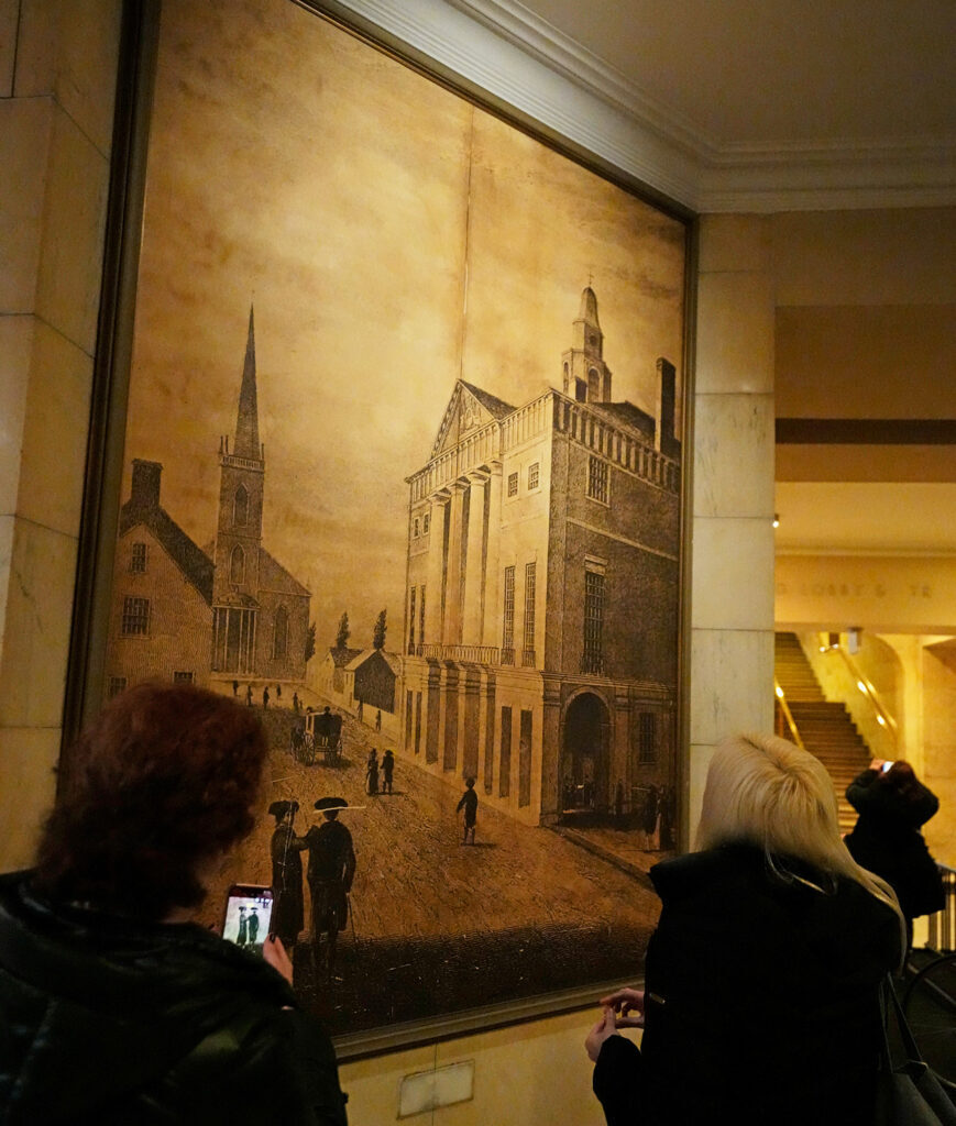 Guests view a historic Woolworth Building photograph