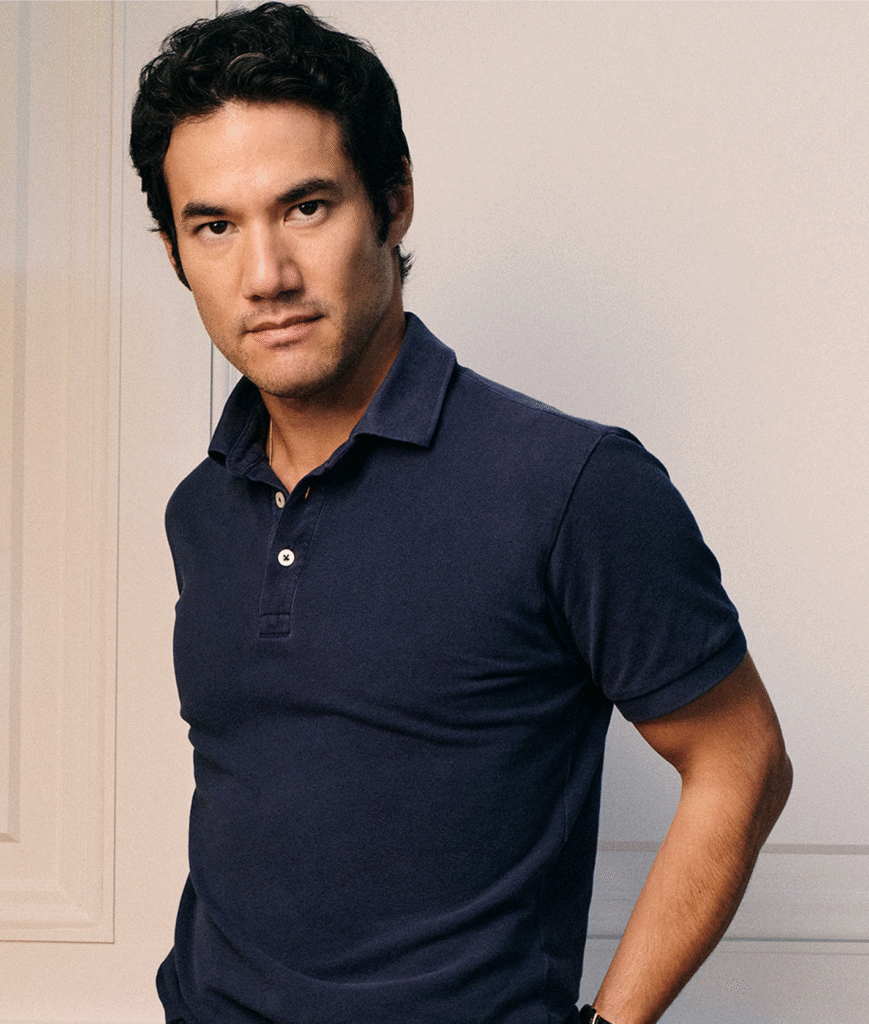 Portrait of a man in a navy polo