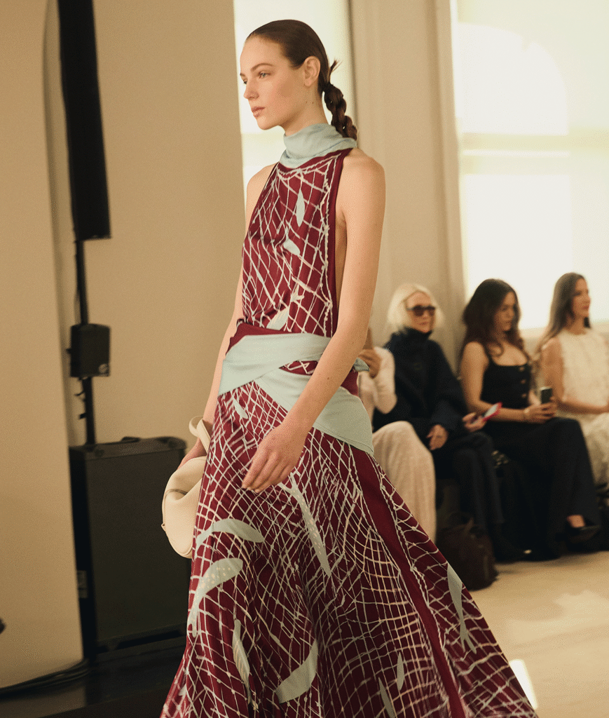 Model in a burgundy and pale blue printed gown on the Altuzarra runway