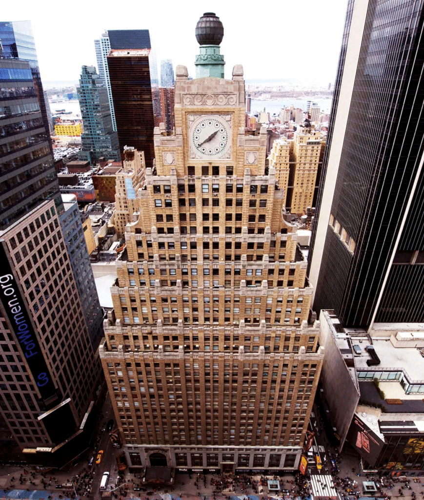 Aerial view of the Paramount Building's stepped tower, clock face and globe